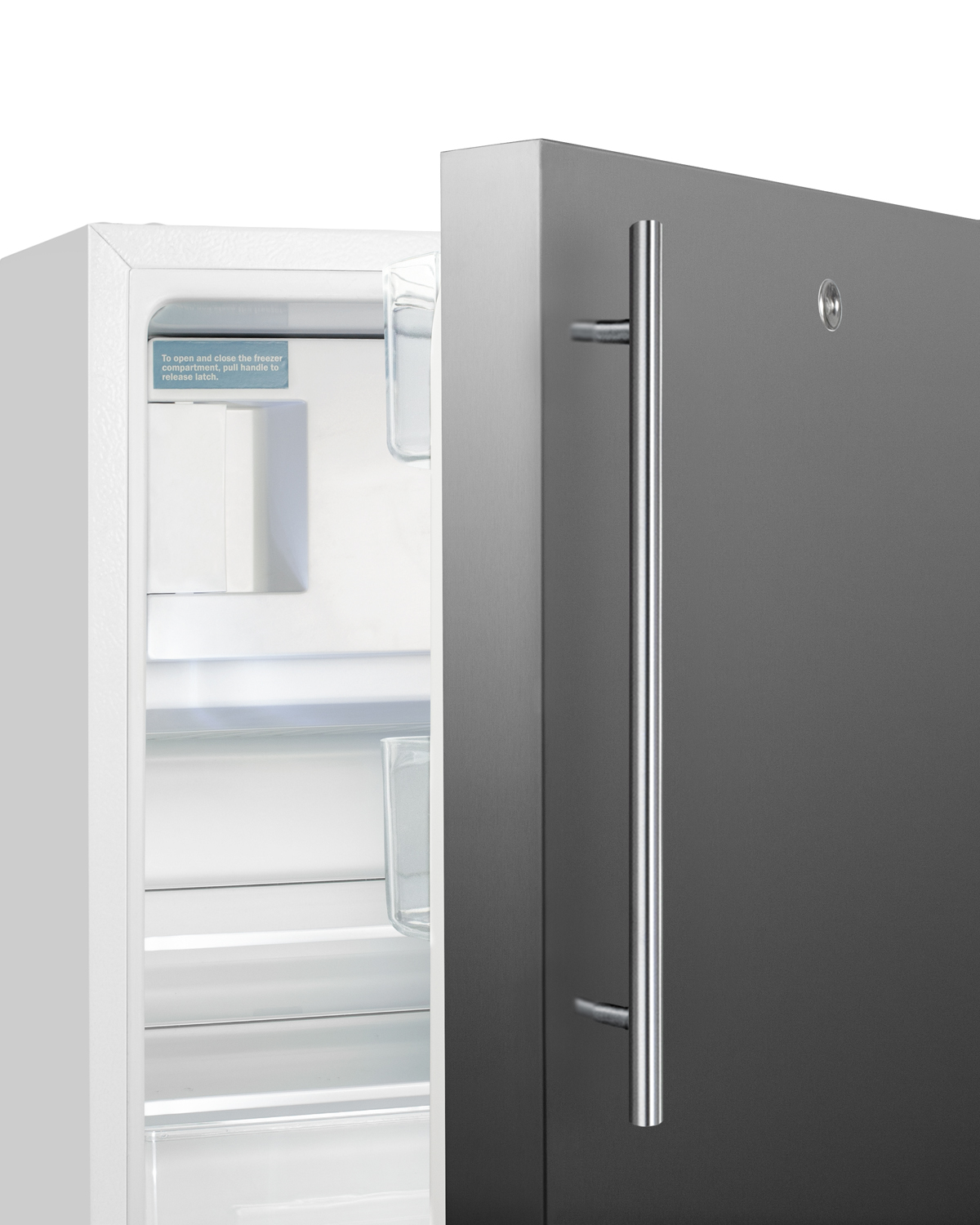 Built-in undercounter ADA compliant refrigerator-freezer in white with reversible SS door and vertical handle for residential use, manual defrost with glass shelves, front lock, and door storage